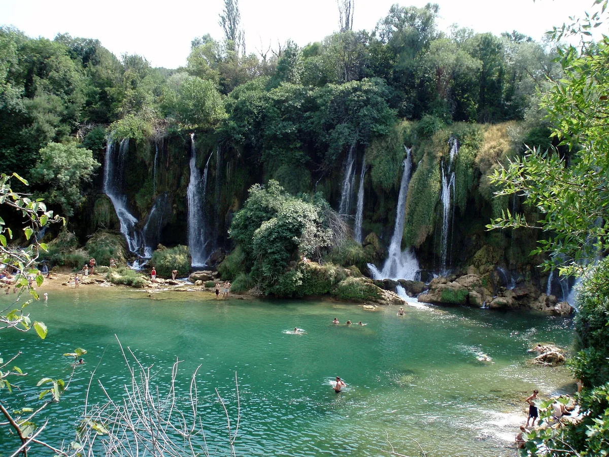Kravica waterfall and its wooded riverbanks